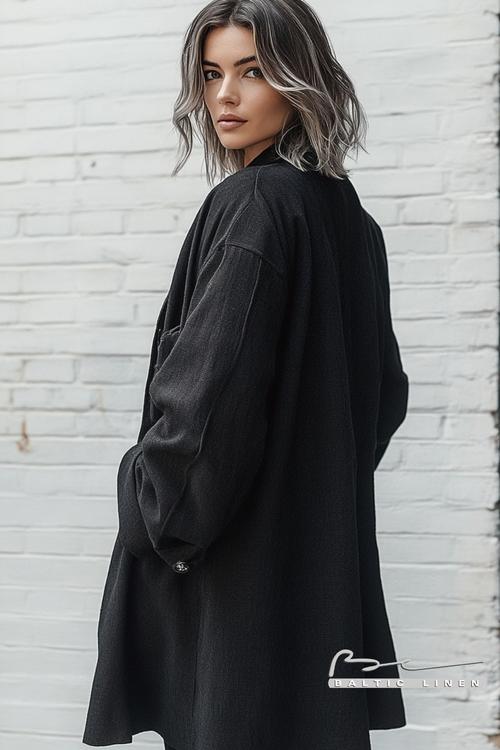 "Asymmetrical Bob and Oversized Black Coat Fashion Trend 2023"